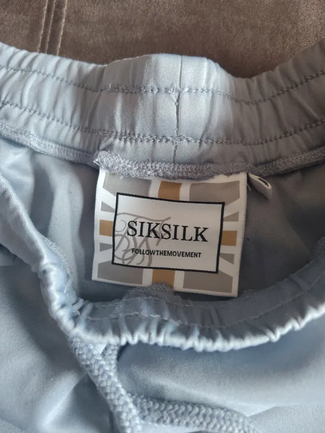 Pantalón SikSilk azul y blanco
