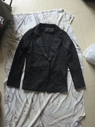 Americana de punto negra