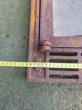 Puerta chimenea fundición con cristal