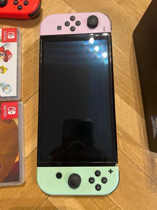 Nintendo Switch OLED + 4 Giochi + Accessori