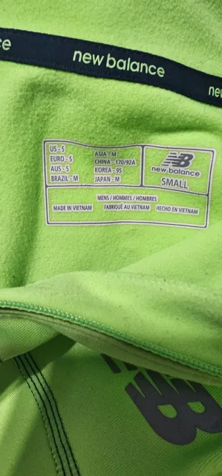 Camisa New Balance verde media cremallera