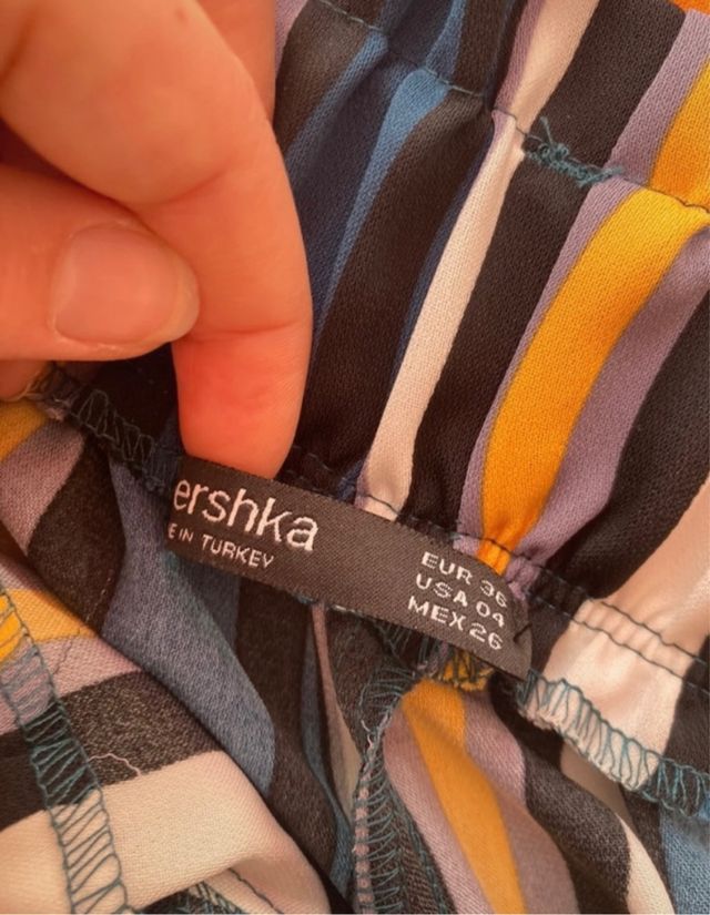 Pantalones fluidos rayas hebilla