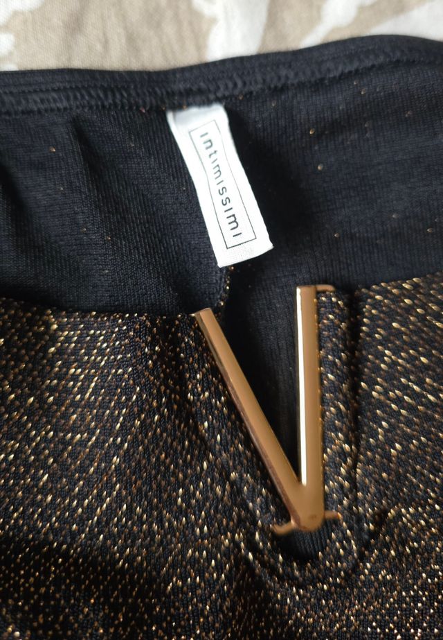 Braga dorada y negra brillante