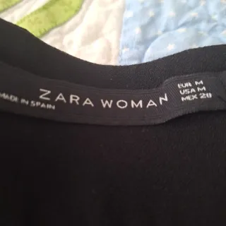 Pantalón elegante negro pata ancha de Zara