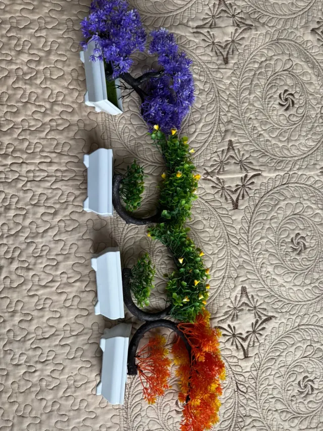 Planta topiaria artificial con maceta