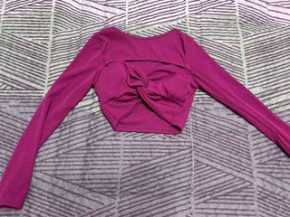 Top fucsia manga larga con nudo