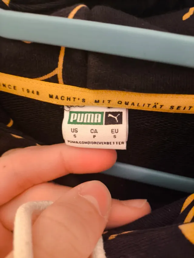 Sudadera Puma x Smiley Negra y Dorada