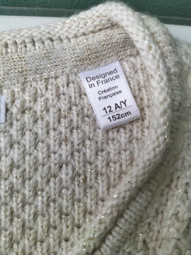 Chaqueta niña punto beige cremallera asimétrica