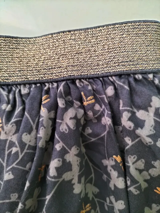 Falda niña gris con libélulas doradas