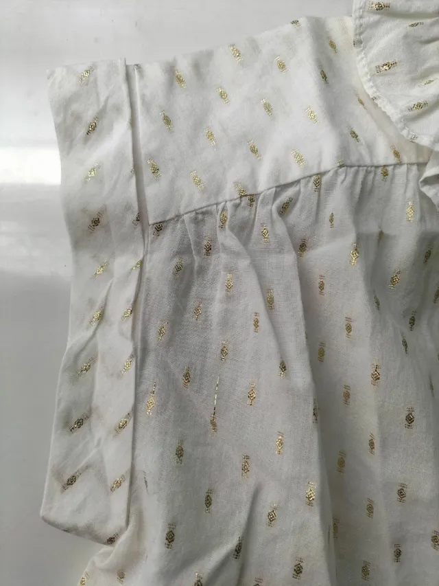 Camisa niña sin mangas con motivos dorados