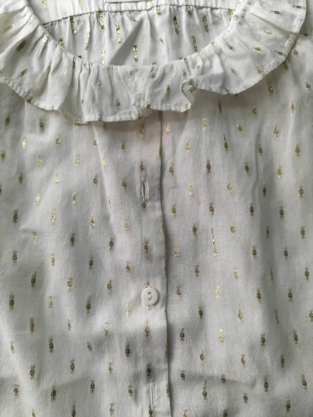 Camisa niña sin mangas con motivos dorados