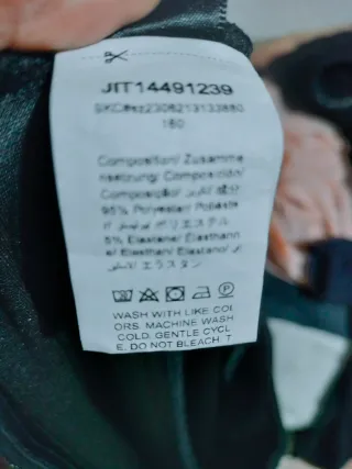 Pantalón campana brillante negro y plateado