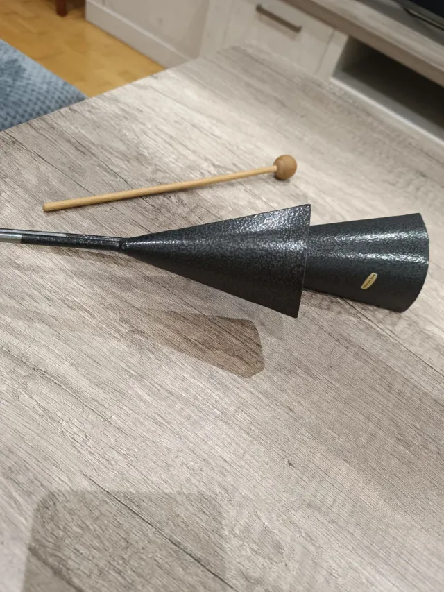 Agogo de percusión con baqueta