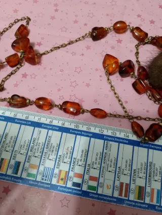 Collana ambra e pon pon marroni