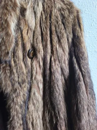 Tre cappotti in pelle marrone