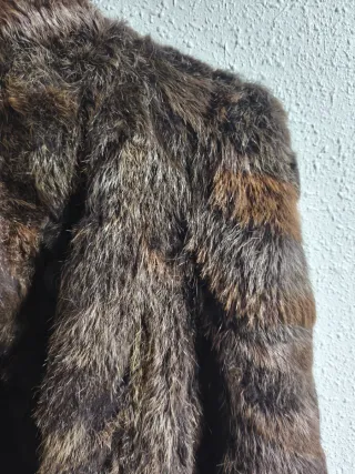 Tre cappotti in pelle marrone