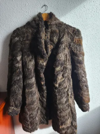 Tre cappotti in pelle marrone