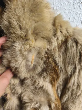 Tre cappotti in pelle marrone