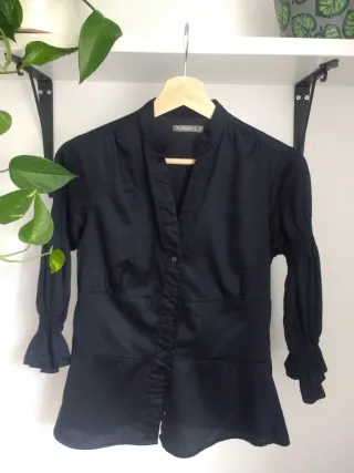 Blusa negra In Extenso
