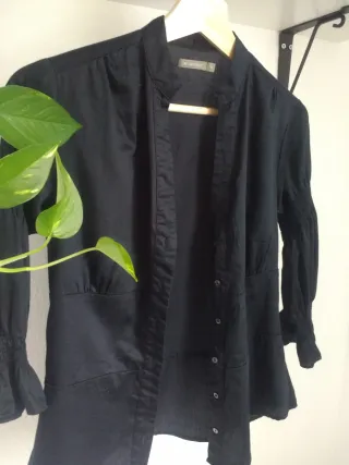 Blusa negra In Extenso