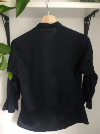 Blusa negra In Extenso