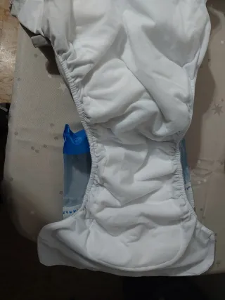 Sobre pañal y almohada de viaje