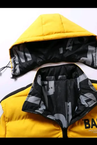 Chaqueta plumífero reversible amarillo y negro