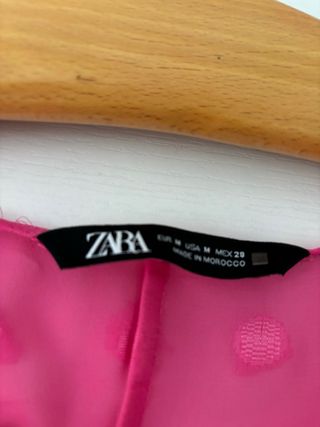 Blusa rosa con flores y lazada