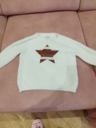 Jersey blanco con estrella de lentejuelas