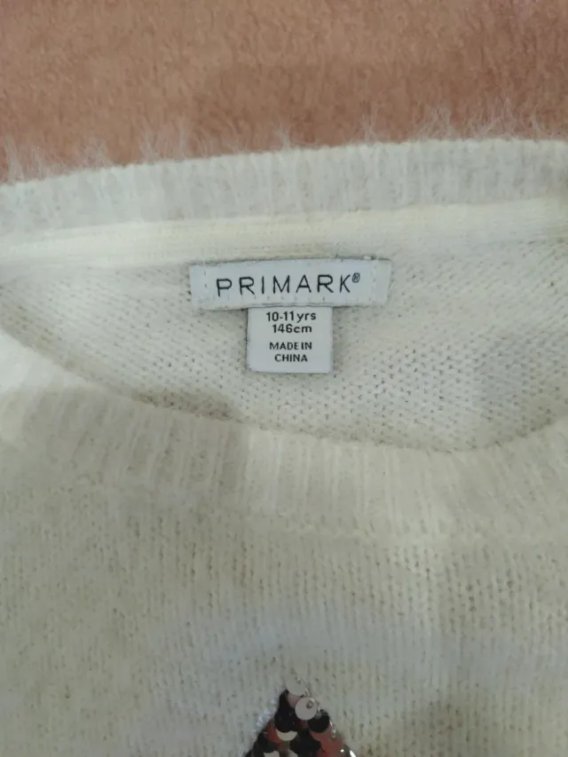 Jersey blanco con estrella de lentejuelas