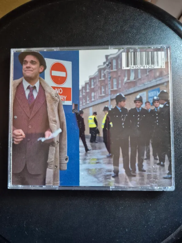 Robbie Williams - Sing When You're Winning.