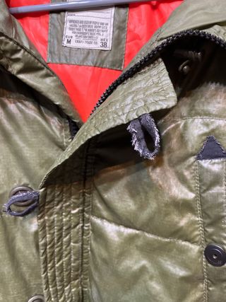 Plumífero hombre verde usado