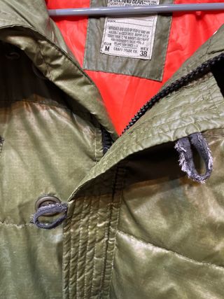 Plumífero hombre verde usado