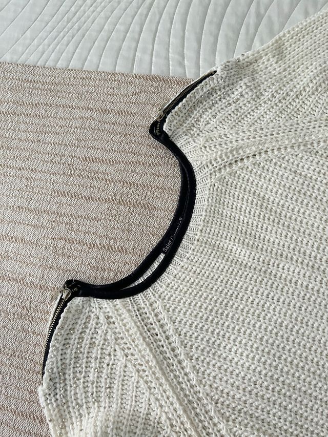 Jersey de punto blanco con cremalleras