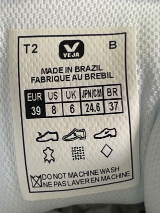 Zapatillas Veja blancas logo rosa