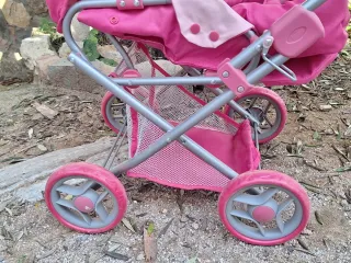 Cochecito de muñecas rosa