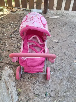 Cochecito de muñecas rosa