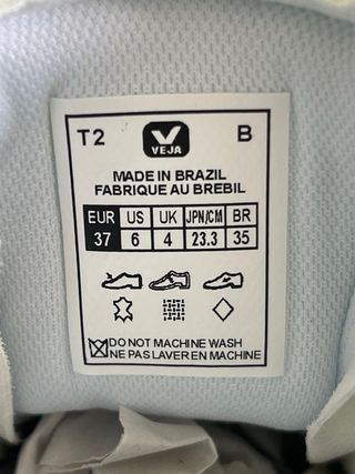 Zapatillas Veja blancas logo rosa