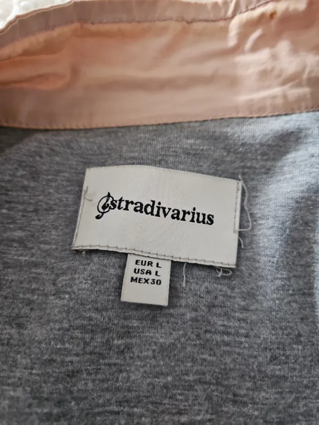 Gabardina Stradivarius rosa mujer