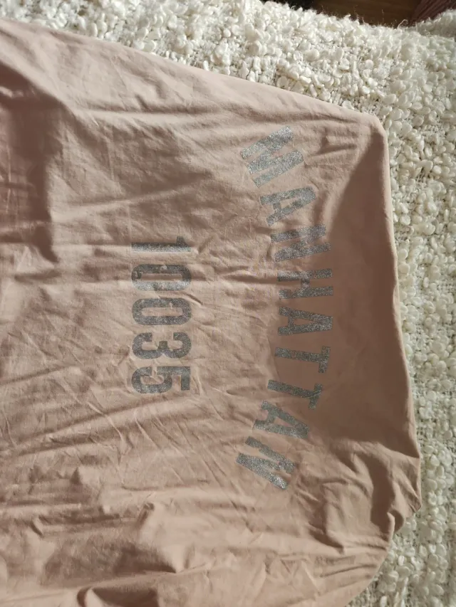 Gabardina Stradivarius rosa mujer