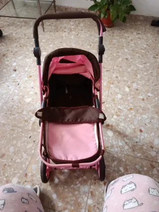 Cochecito de muñecas rosa