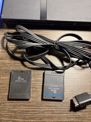 PlayStation 2 con giochi Spyro e Shrek 2