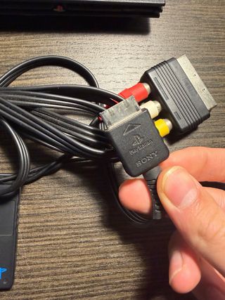 PlayStation 2 con giochi Spyro e Shrek 2