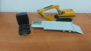 Joal camión con Excavadora Caterpillar