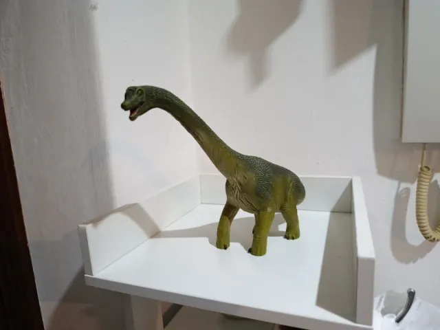 Dinosaurio verde de juguete