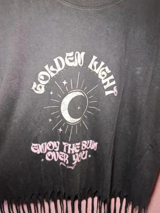 Camiseta sin mangas con flecos