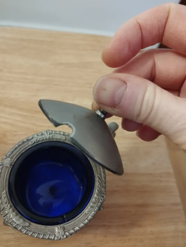 Cafetera antigua de alpaca