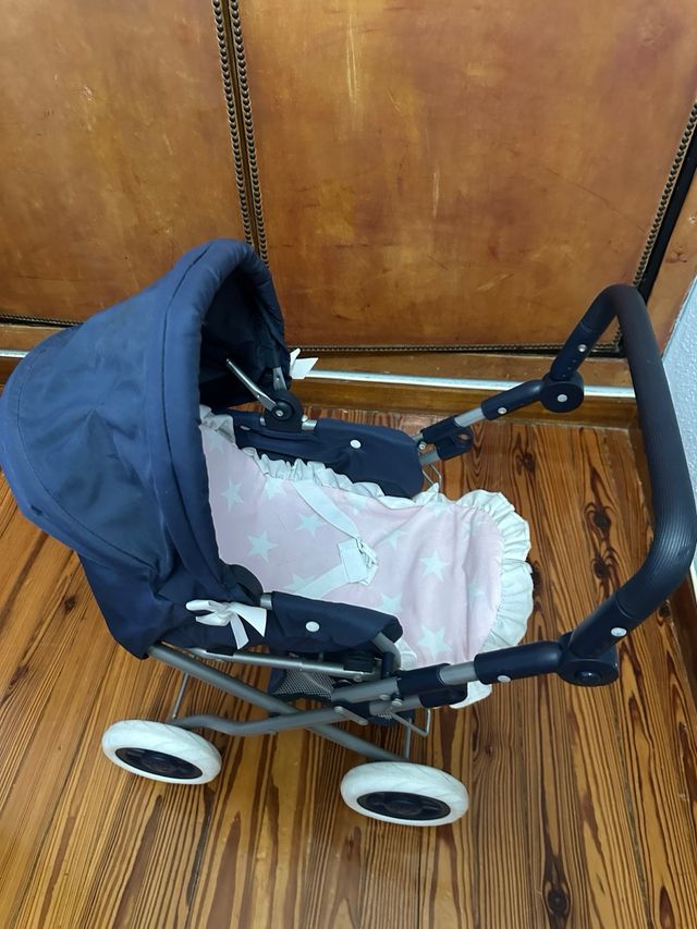 Carrito de muñecas azul con lazos