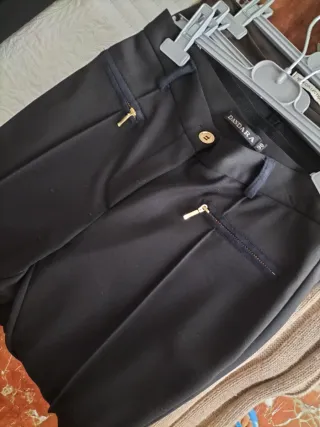 9 pantalones y 8 camisas todo por 10euros ver perf