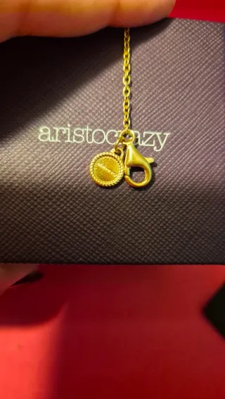 Pulsera Aristocrazy dorada con dijes de plata